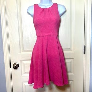 Pink A-line girls dress. Size 12. Back zipper. Light textured material